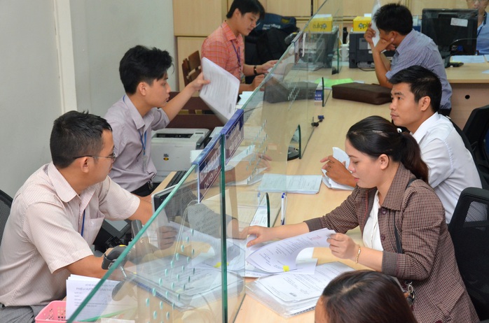 Nhân viên Sở Kế hoạch và Đầu tư TP HCM giải quyết hồ sơ cho doanh nghiệpẢnh: TẤN THẠNH Nhân viên Sở Kế hoạch và Đầu tư TP HCM giải quyết hồ sơ cho doanh nghiệpẢnh: TẤN THẠNH