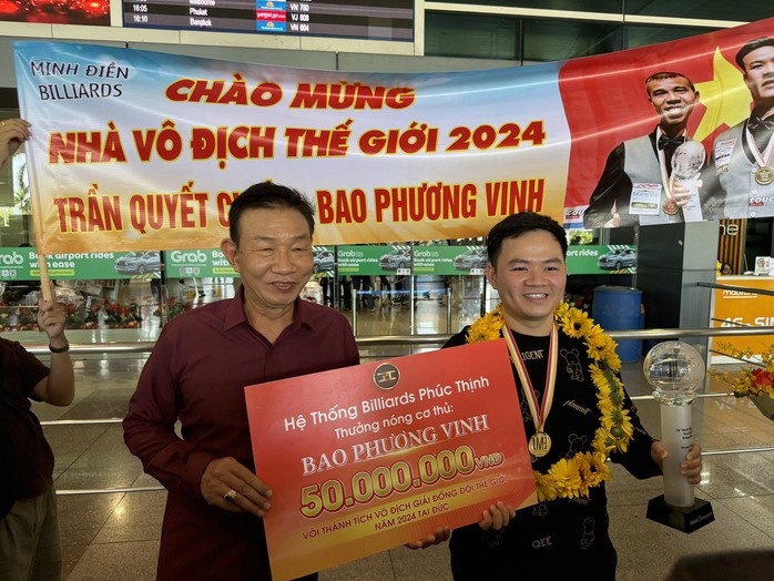 Ngày về của hai nhà vô địch thế giới Trần Quyết Chiến và Bao Phương Vinh- Ảnh 5. Ngày về của hai nhà vô địch thế giới Trần Quyết Chiến và Bao Phương Vinh- Ảnh 5.