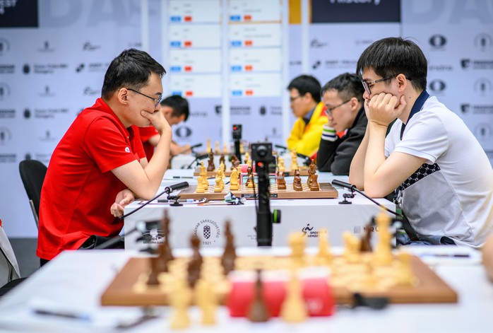 Lê Quang Liêm thắng nhà vô địch thế giới, tuyển Việt Nam bất bại tại Olympiad cờ vua 2024- Ảnh 1. Lê Quang Liêm thắng nhà vô địch thế giới, tuyển Việt Nam bất bại tại Olympiad cờ vua 2024- Ảnh 1.