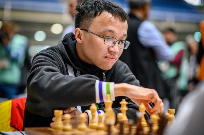 Lê Quang Liêm thắng nhà vô địch thế giới, tuyển Việt Nam bất bại tại Olympiad cờ vua 2024- Ảnh 2. Lê Quang Liêm thắng nhà vô địch thế giới, tuyển Việt Nam bất bại tại Olympiad cờ vua 2024- Ảnh 2.