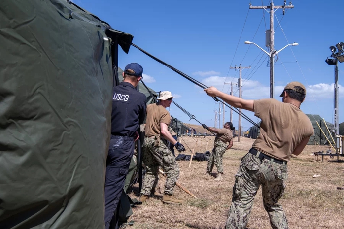 Sailors and Coast Guardsmen erect tents for a migrant holding facility in Guantánamo Bay, Cuba. President Trump has directed the Pentagon and the Department of Homeland Security to prepare for 30,000 detained migrants. Mass Communication Specialist 2nd Class Raphael Dorne/U.S. Navy Sailors and Coast Guardsmen erect tents for a migrant holding facility in Guantánamo Bay, Cuba. President Trump has directed the Pentagon and the Department of Homeland Security to prepare for 30,000 detained migrants. Mass Communication Specialist 2nd Class Raphael Dorne/U.S. Navy