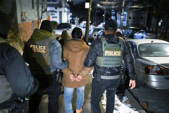 Law enforcement officers walk with a detainee in the Bronx during an immigration enforcement operation on Jan. 28 in New York. (Matt McClain/The Washington Post) Law enforcement officers walk with a detainee in the Bronx during an immigration enforcement operation on Jan. 28 in New York. (Matt McClain/The Washington Post)
