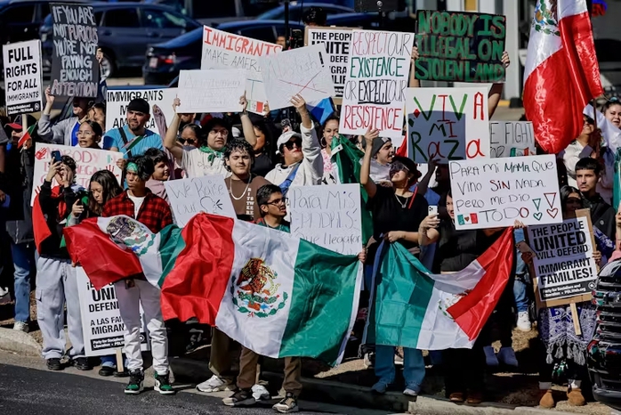 People demonstrate against the Trump administration’s sweeps of undocumented migrants in Georgia. Erik S. Lesser/EPA People demonstrate against the Trump administration’s sweeps of undocumented migrants in Georgia. Erik S. Lesser/EPA