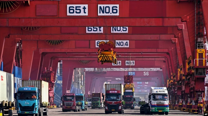 Containers are unloaded from a cargo ship at Qingdao Port, east China's Shandong Province, Feb. 11, 2024, in this photo released by Xinhua News Agency. Containers are unloaded from a cargo ship at Qingdao Port, east China's Shandong Province, Feb. 11, 2024, in this photo released by Xinhua News Agency.