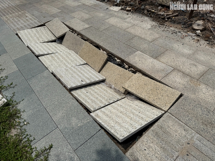 Vì sao vỉa hè trên đường vào nhà ga T3 bị sụt lún dù mới đưa vào hoạt động?- Ảnh 4. Vì sao vỉa hè trên đường vào nhà ga T3 bị sụt lún dù mới đưa vào hoạt động?- Ảnh 4.