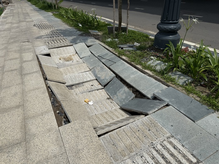 Điện lực Tân Bình phản hồi vụ sụt lún vỉa hè vào nhà ga T3, sẵn sàng tái lập mặt bằng theo thiết kế - Ảnh 1.