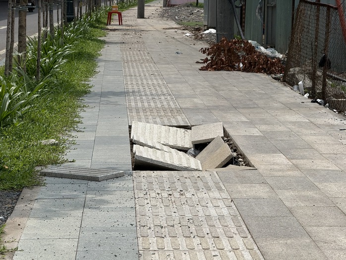 Điện lực Tân Bình phản hồi vụ sụt lún vỉa hè vào nhà ga T3, sẵn sàng tái lập mặt bằng theo thiết kế - Ảnh 2.