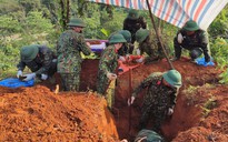 Phát hiện lọ thuỷ tinh đựng di vật chôn kèm hài cốt liệt sĩ