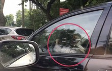 Bé gái cầm vô-lăng xe biển xanh 80B chạy trên phố Hà Nội