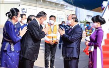 Chủ tịch nước Nguyễn Xuân Phúc tới Vientiane, bắt đầu thăm chính thức CHDCND Lào
