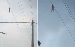 Indonesia: Bé gái treo trên dây cáp điện cao 15 m
