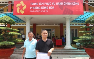 Hình ảnh người dân đi làm thủ tục hành chính ở các phường, xã mới tại Bình Dương