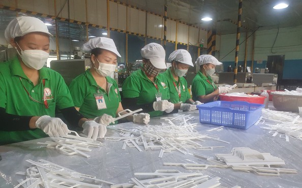 Lương tối thiểu áp dụng ra sao khi bỏ quận, huyện?
